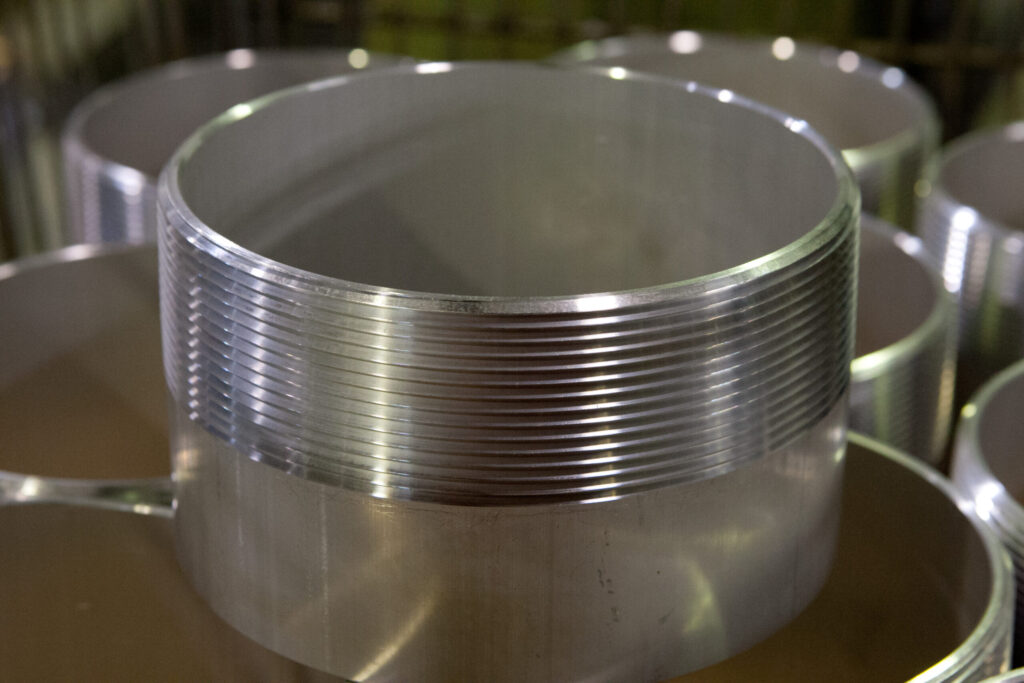 Aluminum cylinders with a threaded exteriors.